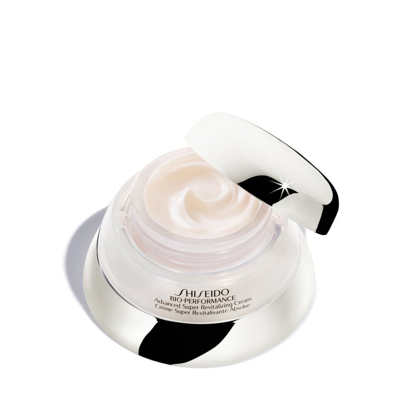 "An open jar of Shiseido Bio-Performance Advanced Super Revitalizing Cream. The jar reveals the rich-textured cream inside. It is labeled with the Shiseido logo and the product name. "